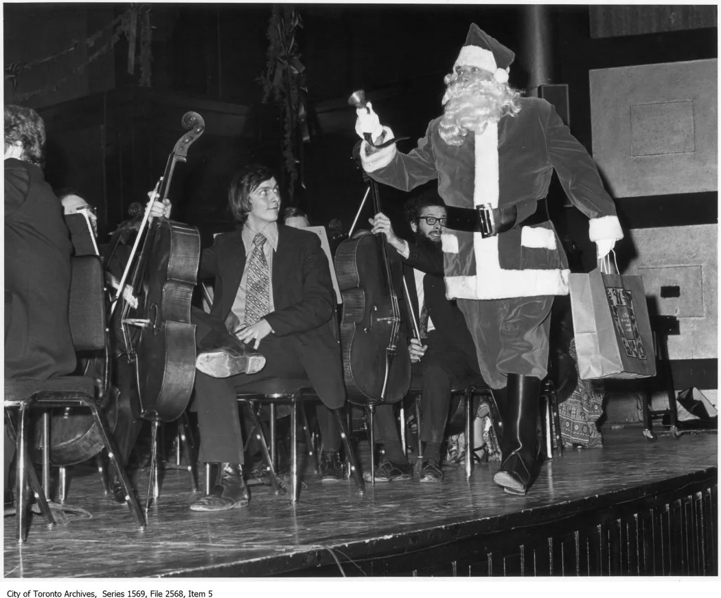 Santa Claus in front of an orchestra Santa Claus in front of an orchestra