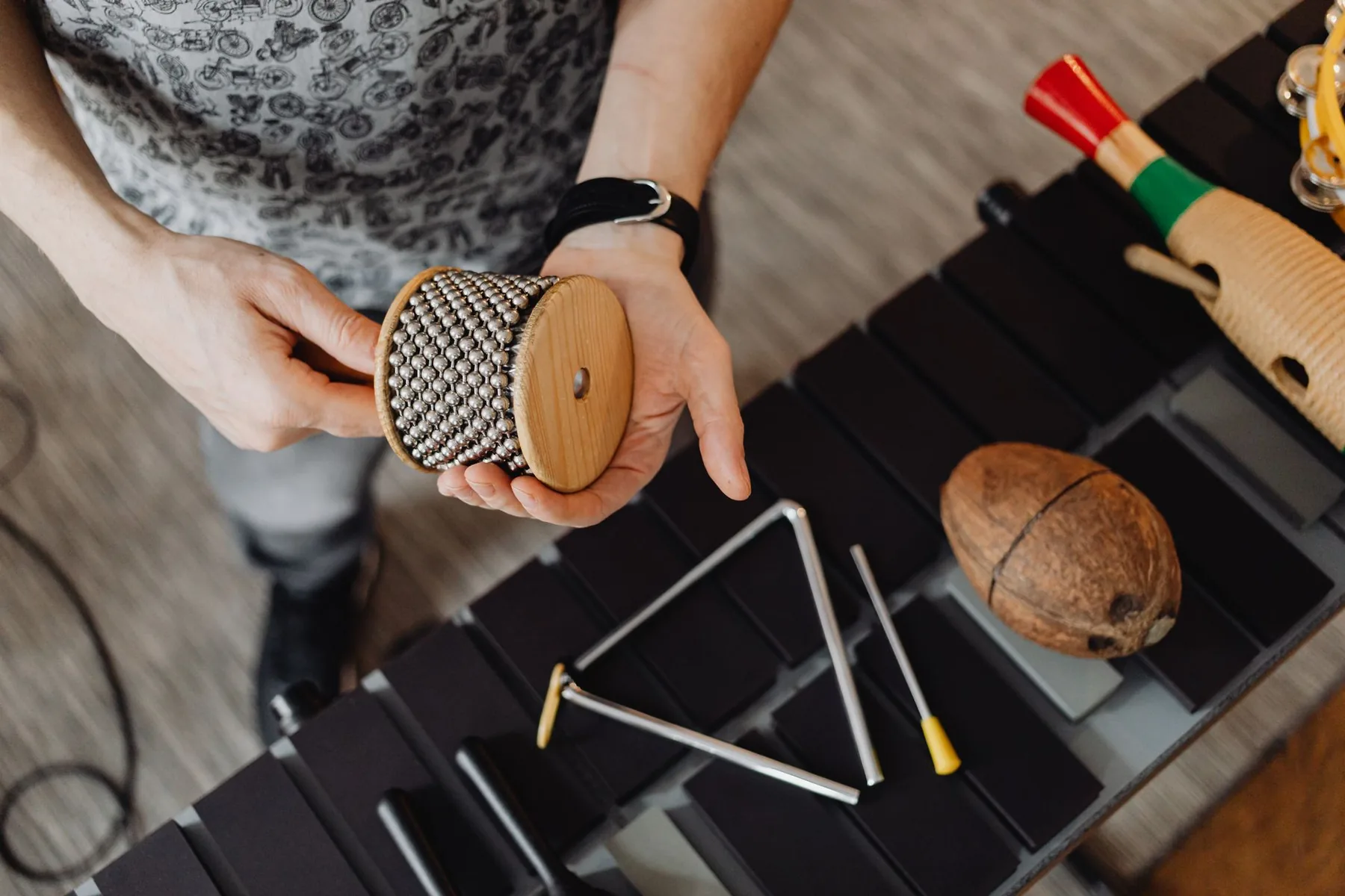 Small percussion instruments above a xylophone Small percussion instruments above a xylophone
