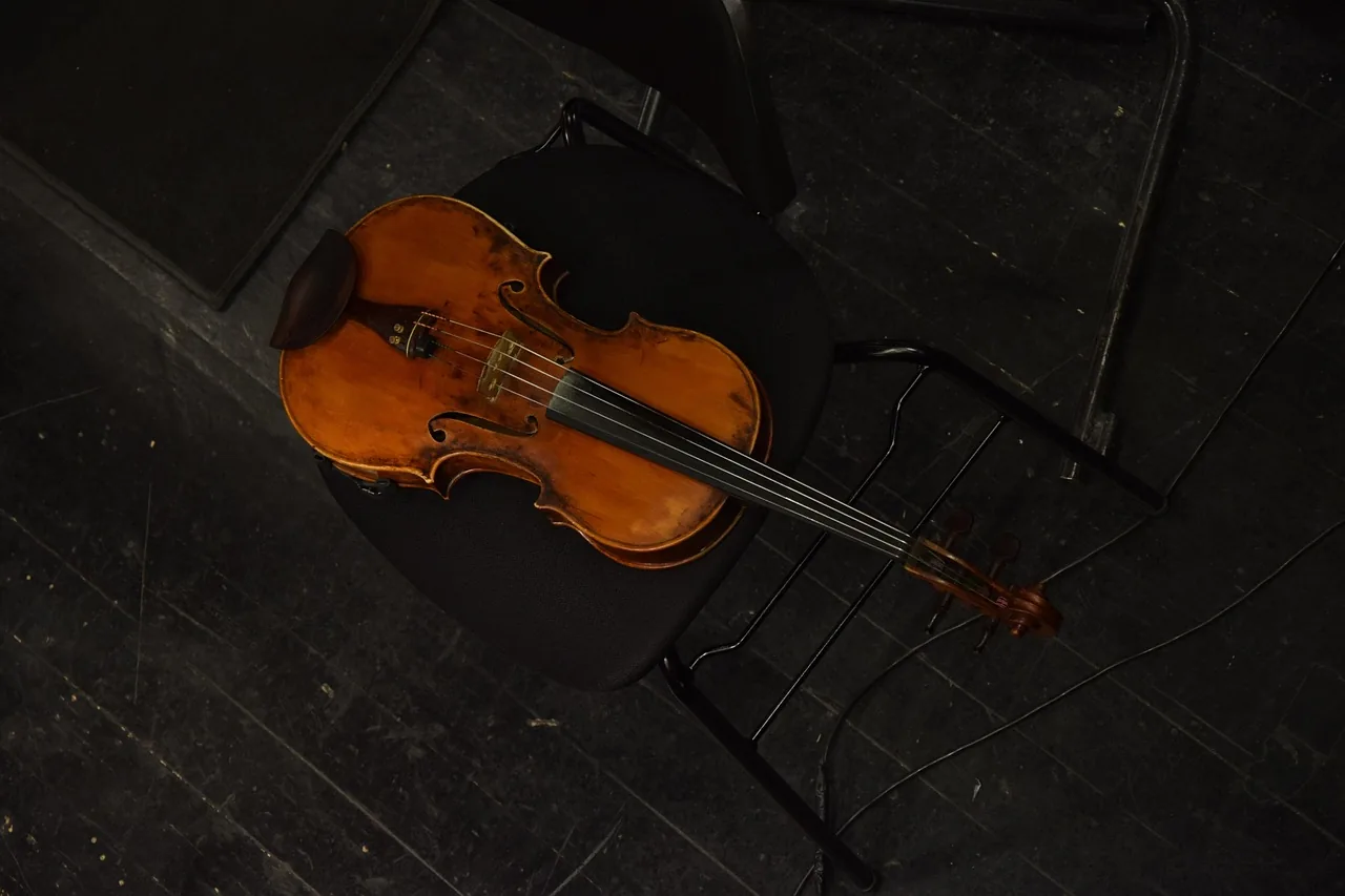 Violin resting on a chair Violin resting on a chair