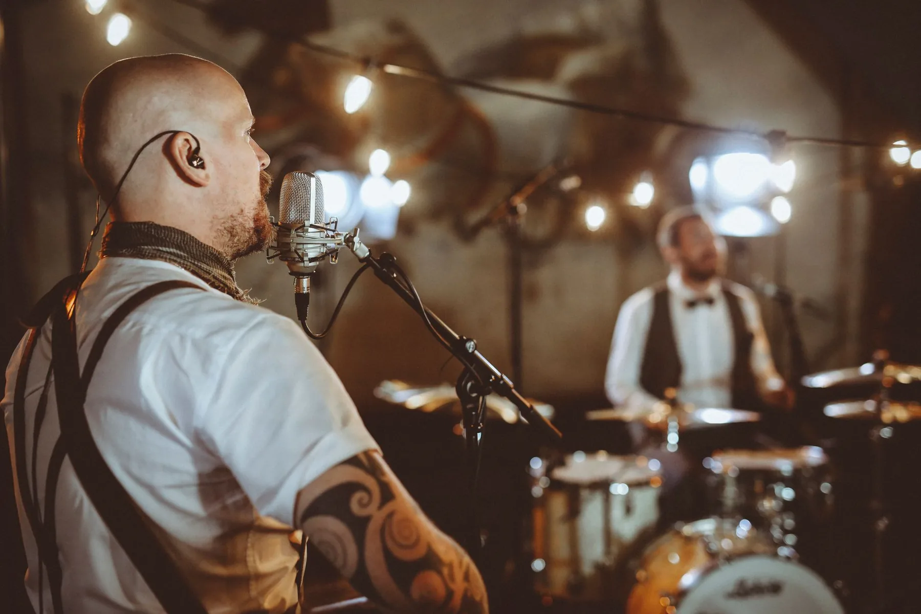 Musicians performing in concert under the spotlights