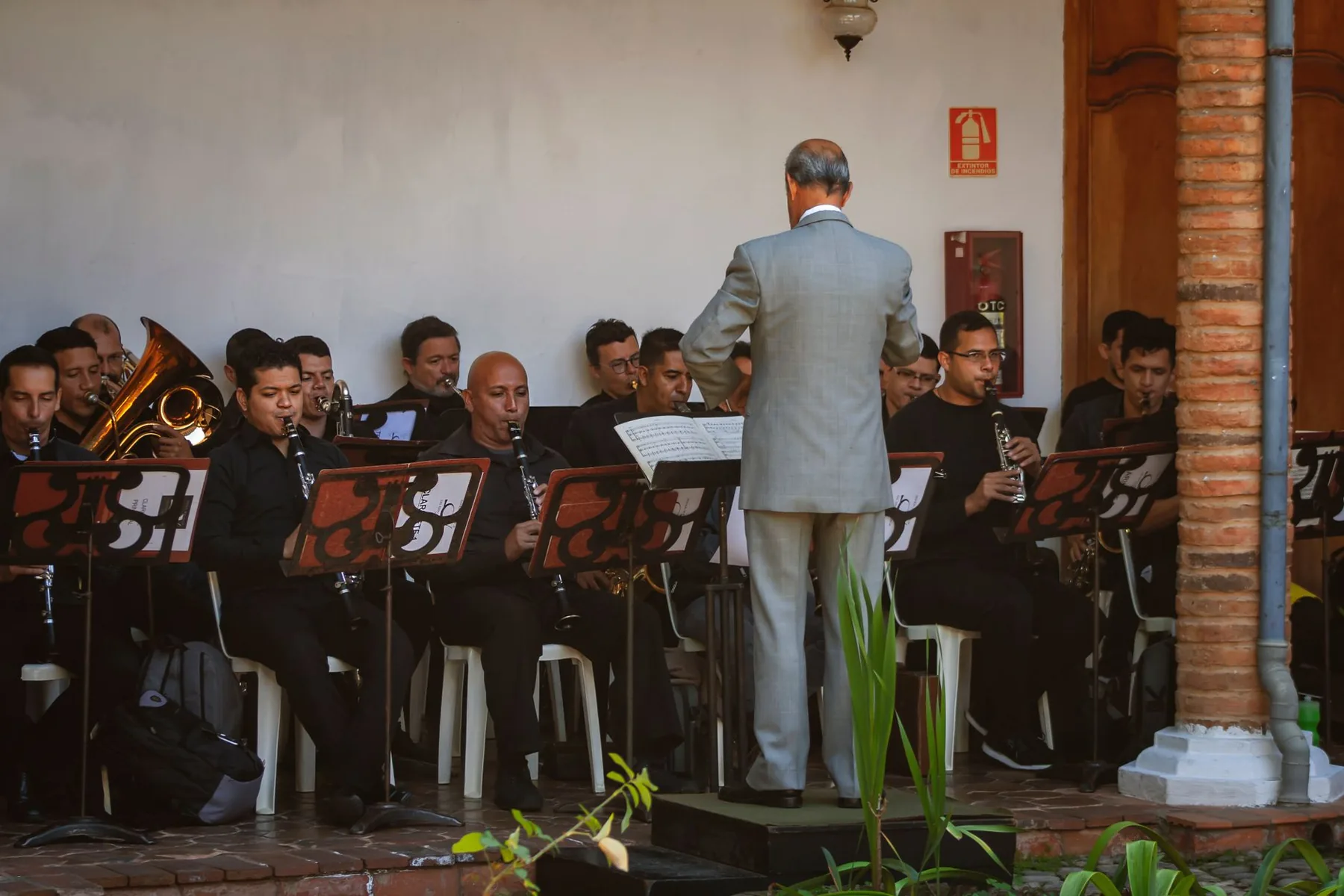 Conductor leading a symphony orchestra Conductor leading a symphony orchestra