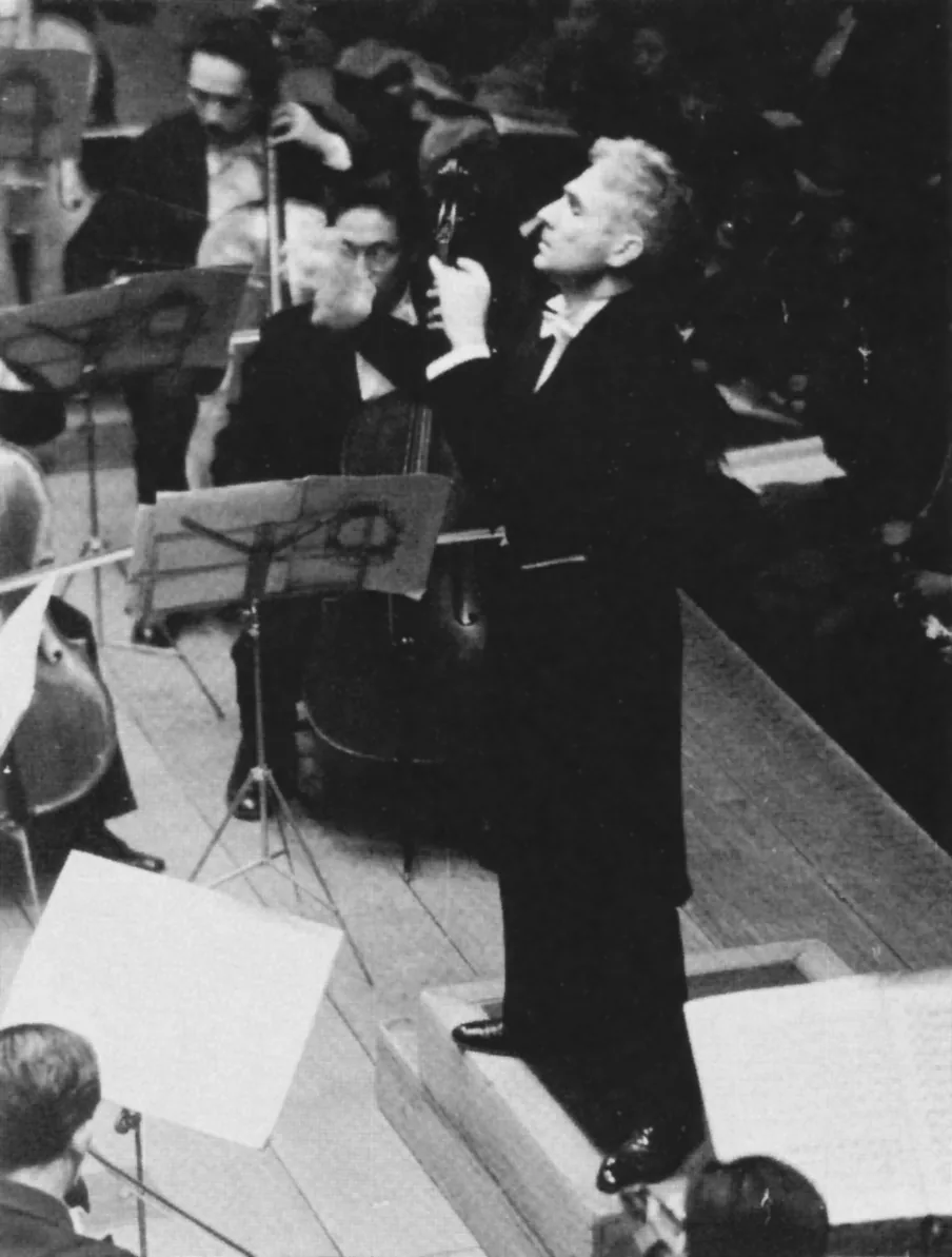 Conductor leading a symphony orchestra Conductor leading a symphony orchestra