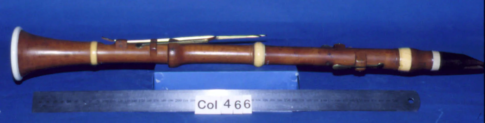 Antique clarinet displayed with a ruler Antique clarinet displayed with a ruler
