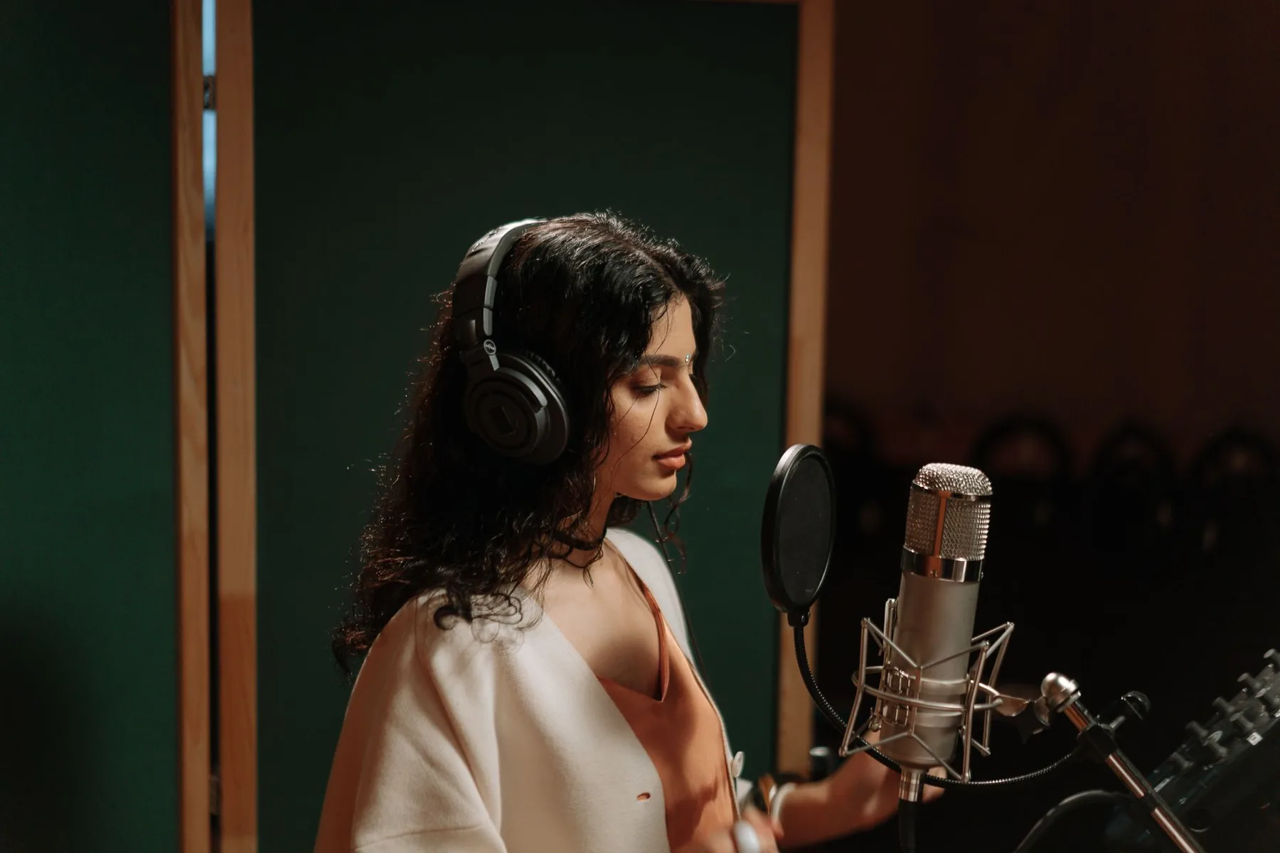 Singer recording a work in a studio Singer recording a work in a studio